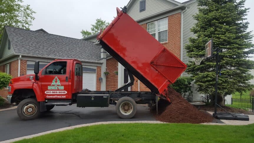 Image of a Central tree Mulch truck delivering chocolate mulch to a residential home